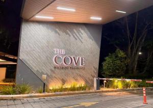 a building with a sign on the side of it at The Cove Premium Suites 7-13pax by IWH Suites in Ipoh