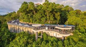 a building on a bridge with cars on a road at ATAP Hotel in Kota Kinabalu