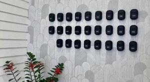 a wall with a bunch of black buttons on it at ATAP Hotel in Kota Kinabalu