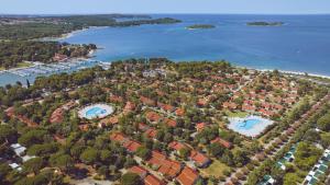 an aerial view of a resort near the water at Camping Bi-Village - Roan in Valbandon