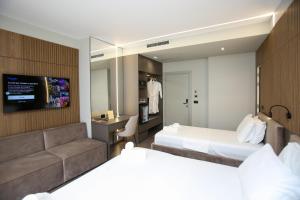 Letto o letti in una camera di Charm Hotel