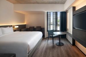 Postel nebo postele na pokoji v ubytování Radisson Hotel Don Mueang Bangkok