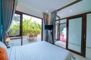 Postel nebo postele na pokoji v ubytování Green World Hoi An Villa