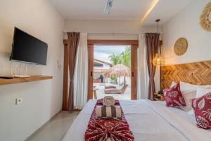 Ένα ή περισσότερα κρεβάτια σε δωμάτιο στο Albe Retreat Balangan Managed by Manara +56 φωτογραφίες