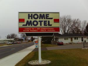 
a sign on the side of a road at Home Motel Abbotsford in Abbotsford
