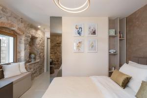 Posteľ alebo postele v izbe v ubytovaní Magnolia Luxury Rooms