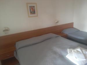 Postel nebo postele na pokoji v ubytování Affittacamere Il Giardino