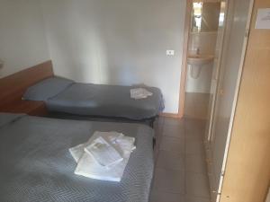 Postel nebo postele na pokoji v ubytování Affittacamere Il Giardino