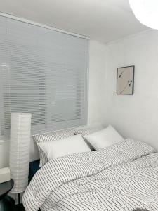Postel nebo postele na pokoji v ubytování Nara Haus