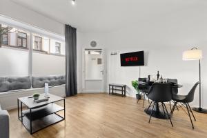 Un televizor și/sau centru de divertisment la Privates City-Apartement nah der Messe und LanxessArena