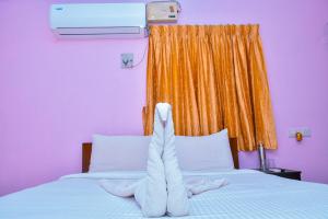 Postel nebo postele na pokoji v ubytování Coral Shelters Pykara
