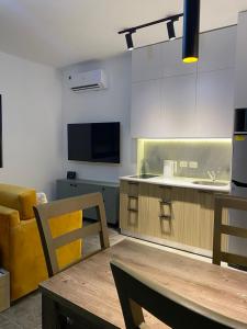 TV a/nebo společenská místnost v ubytování Aqva infinity resort c102