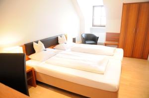 Postel nebo postele na pokoji v ubytování Boardinghouse Wadenspanner