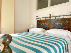 A bed or beds in a room at Camere Francesca