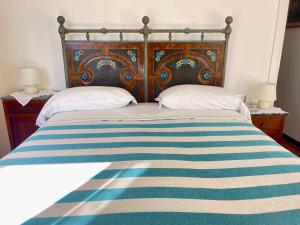 A bed or beds in a room at Camere Francesca