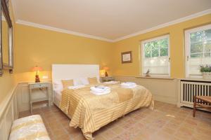 Ένα ή περισσότερα κρεβάτια σε δωμάτιο στο Ferienwohnung Biberhüs Erdgeschoss In Archsum