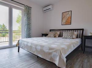 Ένα ή περισσότερα κρεβάτια σε δωμάτιο στο Apartment Villa Troskot