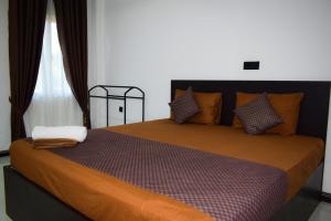 Ένα ή περισσότερα κρεβάτια σε δωμάτιο στο SSS HOTEL