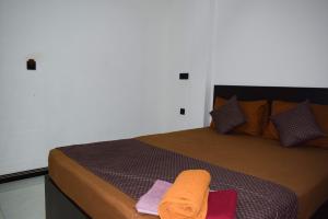 Ένα ή περισσότερα κρεβάτια σε δωμάτιο στο SSS HOTEL