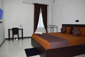 Ένα ή περισσότερα κρεβάτια σε δωμάτιο στο SSS HOTEL