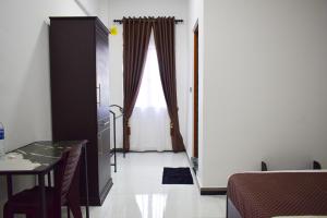 Ένα ή περισσότερα κρεβάτια σε δωμάτιο στο SSS HOTEL