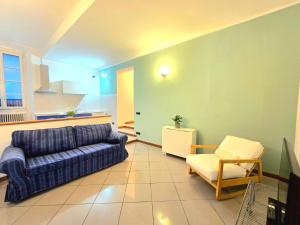 a living room with a couch and a chair at Russomanno Apartments 6 in Como