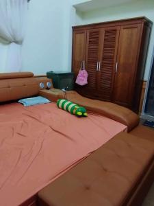 Postel nebo postele na pokoji v ubytování thiên hương + 2 fotografie