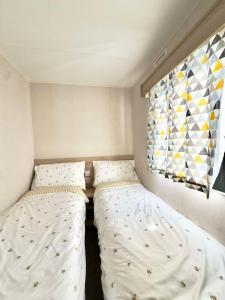 Postel nebo postele na pokoji v ubytování Haven Caravan