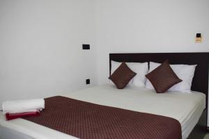 Ένα ή περισσότερα κρεβάτια σε δωμάτιο στο SSS HOTEL