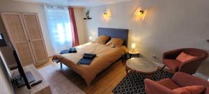 a bedroom with a bed with two candles on it at Gîte Le Bosquet in Mariac