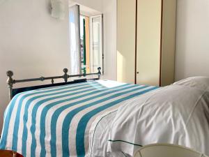 A bed or beds in a room at Camere Francesca