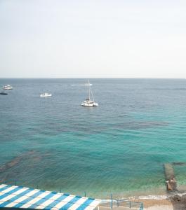 a group of boats in the water at Casa Adelaide in Capri