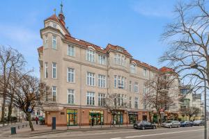 a large building on the side of a street at Blue Mandarin Apartments II in Sopot