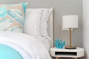 Posteľ alebo postele v izbe v ubytovaní Magnolia Luxury Rooms