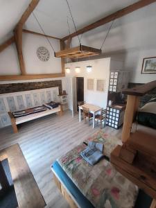 an aerial view of a living room with a table at Pokojíky na Větrné in Malšín
