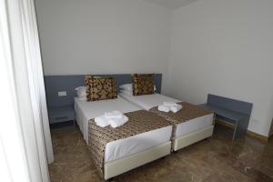 Postel nebo postele na pokoji v ubytování Bed and Breakfast Alla Posta