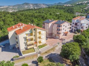 an aerial view of a building in a city at Polina Apartmani in Klenovica