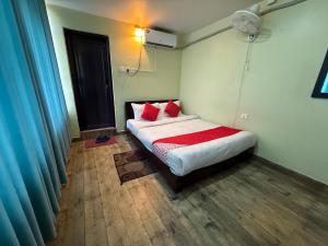 Ένα ή περισσότερα κρεβάτια σε δωμάτιο στο Hotel Arhant Inn