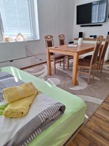 a living room with a table and a table and chairs at Idylle in Thale