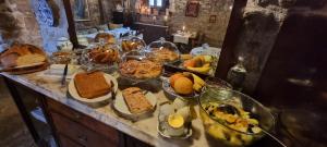 a table with many different types of food on it at Abadia Samitier in Mediano