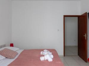 Postel nebo postele na pokoji v ubytování Apartments Ane