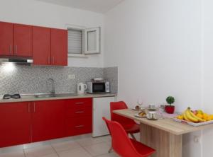 Kuchyň nebo kuchyňský kout v ubytování Apartments Ane