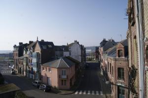 a view of a city street with buildings at Simple Asile in Mers-les-Bains