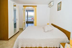 Postel nebo postele na pokoji v ubytování Apartments Ane