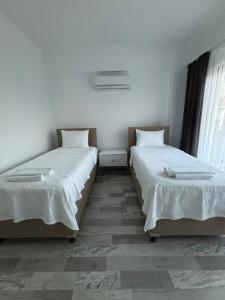 Postel nebo postele na pokoji v ubytování Villa Hirahan + 3 fotografie