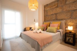 Postel nebo postele na pokoji v ubytování Central 18 - Homey Galicia