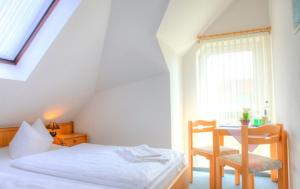 Giường trong phòng chung tại Hotel Nordwind