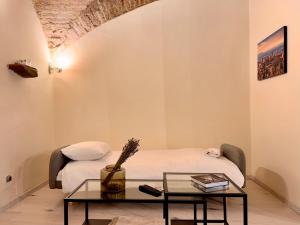 Ένα ή περισσότερα κρεβάτια σε δωμάτιο στο Centro Storico - La Casa del Duca