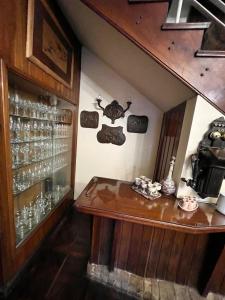 a room with a table and glasses on a wall at B&B La Mendoza in San Miguel de Tucumán +49 photos