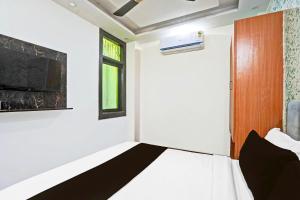 TV a/nebo společenská místnost v ubytování TWAMEV RESIDENCY